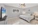 Spacious main bedroom with king-size bed and large TV at 3500 Beneva Rd # 303, Sarasota, FL 34232