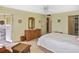Relaxing bedroom with patio access and wicker furniture at 365 Three Lakes Ln # G, Venice, FL 34285