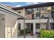 Condo building exterior with parking and landscaping at 365 Three Lakes Ln # G, Venice, FL 34285