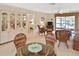 Condo living room with wicker furniture and access to a patio at 365 Three Lakes Ln # G, Venice, FL 34285