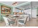 Modern white kitchen with granite countertops and glass-top dining table at 3861 Catalina Dr, Bradenton, FL 34210