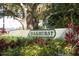 Oakhurst community entrance with lush landscaping at 4045 Oakhurst Dr # 3125, Sarasota, FL 34233
