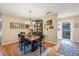Elegant dining area with dark wood table and six chairs at 4045 Oakhurst Dr # 3125, Sarasota, FL 34233