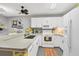 Well-equipped kitchen with white cabinets and granite counters at 4045 Oakhurst Dr # 3125, Sarasota, FL 34233