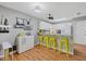 Modern kitchen with white cabinets and yellow accents at 4045 Oakhurst Dr # 3125, Sarasota, FL 34233