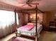 Spacious bedroom with a large four-poster bed and ample closet space at 4047 Lancaster Dr, Sarasota, FL 34241