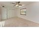 Bright bedroom with ceiling fan, neutral carpeting and double door closet at 4119 52Nd W St, Bradenton, FL 34209