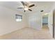 Bright bedroom with ceiling fan, neutral carpeting, and double door closet at 4119 52Nd W St, Bradenton, FL 34209