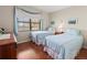 Guest bedroom with two twin beds and wood floors at 425 30Th W Ave # C206, Bradenton, FL 34205