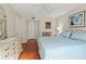 Spacious bedroom with king-size bed and wood floors at 425 30Th W Ave # C206, Bradenton, FL 34205