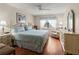 Spacious bedroom with king-size bed and wood floors at 425 30Th W Ave # C206, Bradenton, FL 34205