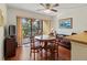 Dining area with round table and chairs, near patio at 425 30Th W Ave # C206, Bradenton, FL 34205
