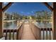 Wooden dock extending over the lake, offering scenic views at 425 30Th W Ave # C206, Bradenton, FL 34205