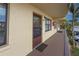 Condo building entryway with brown door and balcony at 425 30Th W Ave # C206, Bradenton, FL 34205