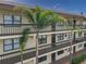 Condo building exterior showcasing balconies and landscaping at 425 30Th W Ave # C206, Bradenton, FL 34205