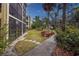 Condo building exterior with lush landscaping at 425 30Th W Ave # C206, Bradenton, FL 34205