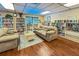 Community library with comfortable seating and many books at 425 30Th W Ave # C206, Bradenton, FL 34205