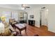 Living room with hardwood floors, a door to outside and a view to the bedroom at 425 30Th W Ave # C206, Bradenton, FL 34205