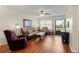 Living room with hardwood floors, a comfy sofa and a view to outside at 425 30Th W Ave # C206, Bradenton, FL 34205