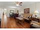 Bright living room with hardwood floors and comfy seating at 425 30Th W Ave # C206, Bradenton, FL 34205
