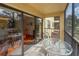 Private screened balcony with table and chairs at 425 30Th W Ave # C206, Bradenton, FL 34205