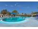 Inviting kidney-shaped swimming pool with shaded seating at 425 30Th W Ave # C206, Bradenton, FL 34205