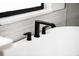 Elegant bathroom with a freestanding tub and matte black fixtures at 4497 N Salford Blvd, North Port, FL 34286