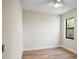 Simple bedroom with wood-look floors and a window at 4497 N Salford Blvd, North Port, FL 34286