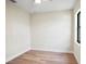Spacious bedroom with wood-look floors and a window at 4497 N Salford Blvd, North Port, FL 34286