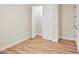 Bright bedroom with wood-look floors and a spacious closet at 4497 N Salford Blvd, North Port, FL 34286