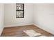 Bright bedroom featuring wood-look tile flooring and a window at 4497 N Salford Blvd, North Port, FL 34286