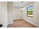 Bright home office space with wood-look floors and large window at 4497 N Salford Blvd, North Port, FL 34286