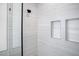 Clean shower with modern tile and built-in shelves at 4497 N Salford Blvd, North Port, FL 34286