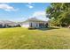 Spacious backyard with lush lawn and mature trees at 4534 Fern Dr, Bradenton, FL 34208