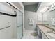 Walk-in shower with tiled walls and grab bar at 4534 Fern Dr, Bradenton, FL 34208