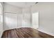 Bedroom with wood-look floors, double door closet and bathroom access at 4534 Fern Dr, Bradenton, FL 34208