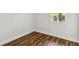 Simple bedroom with wood-look floors and a window at 4534 Fern Dr, Bradenton, FL 34208