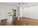 Spacious bedroom with hardwood floors and access to a sunroom at 4534 Fern Dr, Bradenton, FL 34208