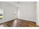 Well-lit bedroom, featuring wood-look floors and multiple windows at 4534 Fern Dr, Bradenton, FL 34208