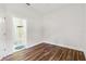 Bedroom with bathroom access and wood-look floors at 4534 Fern Dr, Bradenton, FL 34208