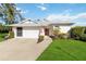 Single-story home with attached garage and landscaped lawn at 4534 Fern Dr, Bradenton, FL 34208