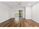 Spacious living room with wood-look floors and sliding glass doors at 4534 Fern Dr, Bradenton, FL 34208