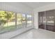 Relaxing screened porch with tiled flooring and multiple windows at 4534 Fern Dr, Bradenton, FL 34208