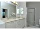 Bathroom with double sinks and a walk-in shower at 4617 Samoset Dr, Sarasota, FL 34241