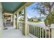 Covered front porch with white railings and columns at 4817 Charles Partin Dr, Parrish, FL 34219