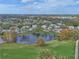 Aerial view of community near golf course and pond at 5469 Fair Oaks Street St # 5C, Bradenton, FL 34203