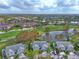 Aerial view of community with houses, golf course and pond at 5469 Fair Oaks Street St # 5C, Bradenton, FL 34203