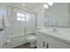Bathroom with a shower/tub combo, white vanity, and window at 5469 Fair Oaks Street St # 5C, Bradenton, FL 34203
