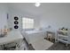 Cozy bedroom with a full-size bed, workspace, and window with blinds at 5469 Fair Oaks Street St # 5C, Bradenton, FL 34203