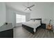 King-size bed in a well-lit bedroom with ample floor space at 5469 Fair Oaks Street St # 5C, Bradenton, FL 34203
